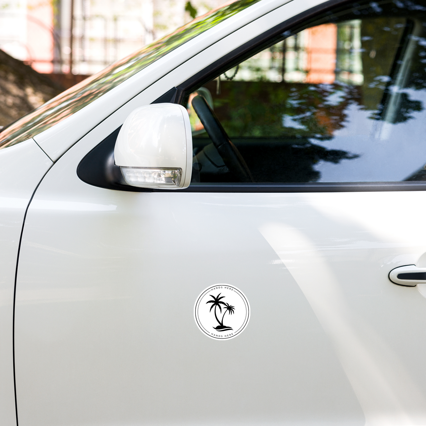 White Palm decal or magnet design on door panel of white car showing adherence to vehicle